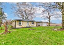 Charming one-story home with a well-maintained lawn and inviting curb appeal at 7764 S State Road 109, Markleville, IN 46056