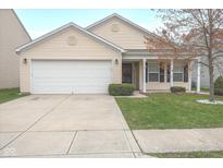 Charming single-story home featuring a well-manicured lawn, two-car garage, and a welcoming front porch at 12722 Brady Ln, Noblesville, IN 46060