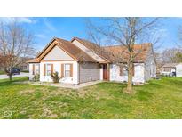 Charming single-Gathering home featuring a well-maintained lawn and classic architectural details at 448 Yorktown Ln, Avon, IN 46123
