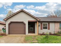 Charming single-story home with a cozy front porch and attached garage at 5431 Carlton Ct, Indianapolis, IN 46224