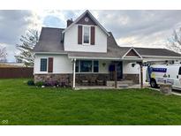 Charming two-story home features a stone foundation, updated siding and trim, and a welcoming front porch at 550 Pearl St, Cicero, IN 46034