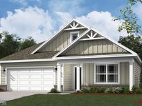 Inviting exterior elevation showcasing a two-car garage and covered porch at 2199 Warbler St, Danville, IN 46122