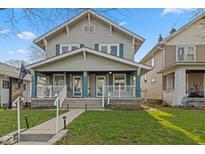 Charming two-story home featuring a welcoming front porch and classic architectural details at 601 Wallace Ave, Indianapolis, IN 46201