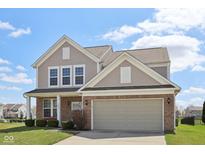 Charming two-story home with brick and vinyl siding, complemented by a well-manicured lawn at 6681 Keepsake Dr, Whitestown, IN 46075