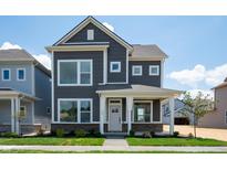Charming two-story home with a welcoming front porch and beautifully landscaped front yard at 799 Rose Garden Way, Westfield, IN 46074