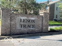 Lenox Trace community sign at entrance shows well maintained grounds and landscaping at 963 Wickham Ct # 103, Carmel, IN 46032