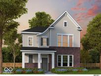Charming two-story home featuring gray siding, brick accents, and a welcoming front porch at 12009 Jeff Ct, Noblesville, IN 46060