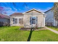 Charming single-story home featuring a well-maintained lawn and inviting curb appeal at 14317 Banister Dr, Noblesville, IN 46060