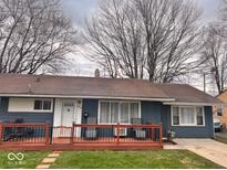 Charming single-story home with a cozy porch featuring stylish outdoor seating, perfect for relaxing at 2517 Horton Dr, Anderson, IN 46011