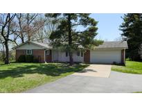 Charming single-story brick home with attached garage and well-maintained front lawn at 2621 E 500 N, Whiteland, IN 46184