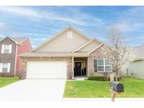 Charming single-story brick home with a well-manicured lawn and inviting curb appeal at 5301 Tanglewood Ln, Whitestown, IN 46075