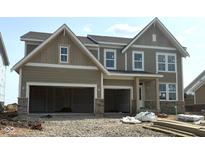 Inviting new construction home with a three-car garage and stylish exterior at 6229 Hampton Walk Blvd, McCordsville, IN 46055