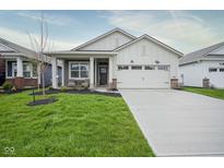 Charming one-story home featuring a well-manicured lawn and a two-car attached garage at 714 Faudree Dr, Westfield, IN 46074