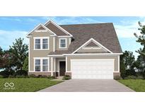 Charming two-story home features a neutral color, a two-car garage, and a well-maintained lawn at 1056 Stubble Run, Danville, IN 46122