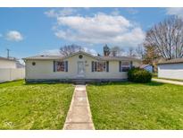 Charming single-story home with a well-maintained lawn and inviting walkway to the front door at 220 E Meridian St, Atlanta, IN 46031