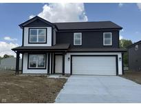 Charming two-story home featuring a two-car garage and classic black and white design at 3315 Godby Dr, Sheridan, IN 46069