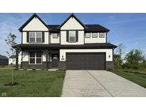 Charming two-story home with black trim, a gray garage door, and a well-manicured front yard at 5692 Coulter Way, Greenwood, IN 46143