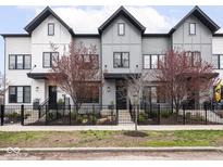 Charming townhomes boast modern architecture, black framed windows and beautiful landscaping at 1326 E 10Th St, Indianapolis, IN 46202