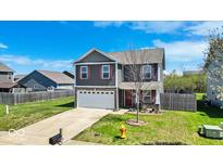 Charming two-story home with a well-maintained lawn and attached two-car garage at 159 Longleaf Ln, Greenfield, IN 46140