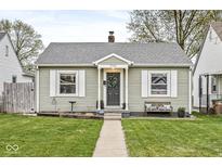 Charming one-story home with a well-manicured lawn, and a welcoming front door and entryway at 1741 Caldwell Pl, Columbus, IN 47201