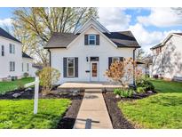 Charming two-story home with a well-maintained front yard and inviting entrance, perfect for a cozy Gathering residence at 143 W Washington St, Mooresville, IN 46158