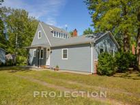 Charming Cape Cod style home featuring classic details and a well-maintained yard at 2109 N Janney Ave, Muncie, IN 47304