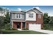 Charming two-story home featuring a brick facade, siding, a two-car garage, and a well-manicured lawn at 2209 Boxwood Dr, Greenfield, IN 46140