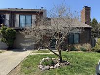 Charming brick townhouse with a balcony, chimney and well-kept front yard at 346 E St Clair E St, Indianapolis, IN 46202