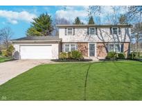 Charming two-story home with a well-manicured lawn and attached two car garage at 4106 Armon Ct, Carmel, IN 46033