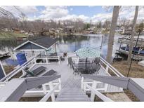 Elevated deck featuring stairs, lounge chairs, and scenic lake views at 7668 Heather Dr, Nineveh, IN 46164