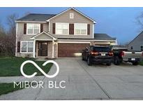 Charming two-story home with a well-maintained lawn, a two-car garage, and mature trees enhancing curb appeal at 804 Seabreeze Dr, Avon, IN 46123