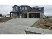 A new two-story home with a two-car garage and a large concrete driveway at 2249 Oakmont Dr, Plainfield, IN 46168