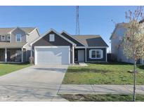 Charming one-story home with a well-maintained lawn and a two-car garage at 944 Redwood Dr, Franklin, IN 46131