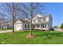 Charming two-story home featuring a well-manicured lawn and inviting front porch at 1950 Midnight Pass, Brownsburg, IN 46112