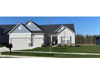 Charming single-story home with a two-car garage, beautiful landscaping, and a welcoming entrance at 2755 Ruffian Dr, Westfield, IN 46074