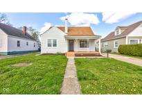 Charming single-story home with a tidy front yard, walkway, and inviting porch at 334 N 15Th Ave, Beech Grove, IN 46107