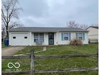 Charming single-story home featuring a well-maintained front yard and an attached garage at 4506 Phoenix Dr, Indianapolis, IN 46241