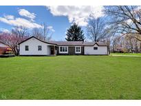 Charming single-story home with a well-maintained lawn and inviting curb appeal on a bright day at 7859 Jennifer Ln, Brownsburg, IN 46112