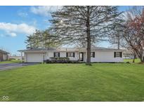 Charming single-story home with a well-maintained lawn and attached garage at 18037 Promise Rd, Noblesville, IN 46060