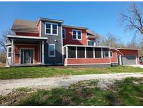 Charming two-story home featuring a screened in porch, garage, and appealing two-tone color scheme at 359 N Jefferson St, Martinsville, IN 46151