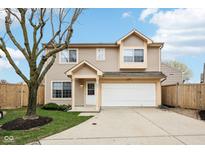 Charming two-story home with a well-maintained lawn and attached two-car garage at 693 Cembra Dr, Greenwood, IN 46143