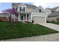 Well-maintained two-story home with manicured lawn, two car garage and an inviting covered entryway at 12866 Thames Dr, Fishers, IN 46037