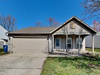 Charming single-story home with a covered porch and attached two-car garage at 2606 Bristlecone Dr, Indianapolis, IN 46217