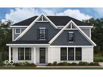 Charming two-story home with white brick and charcoal shingles, offering classic curb appeal and modern design elements at 15087 Covebrook Ln, Fishers, IN 46037