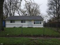 Cozy single story home featuring a fenced in front yard, offering both security and curb appeal at 1931 Brentwood Dr, Anderson, IN 46011