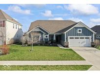 Charming single-Gathering home with a well-manicured lawn, attached two-car garage, and inviting curb appeal at 5178 Aegis Dr, Noblesville, IN 46062