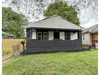 Charming home featuring a freshly painted exterior, well-maintained lawn, and quaint front porch at 1032 Groff Ave, Indianapolis, IN 46222