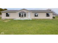 Charming single-story home featuring a tidy front yard with simple landscaping at 1528 E 300 N, Lebanon, IN 46052