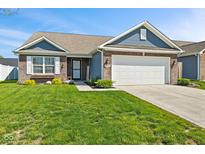 Charming single-story home features brick and siding exterior, attached two-car garage, and well-manicured lawn at 2936 W Calimanco Ln, Monrovia, IN 46157