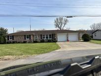 Charming brick ranch-style home featuring a two-car garage and well-maintained landscaping at 359 Anel Dr, Martinsville, IN 46151